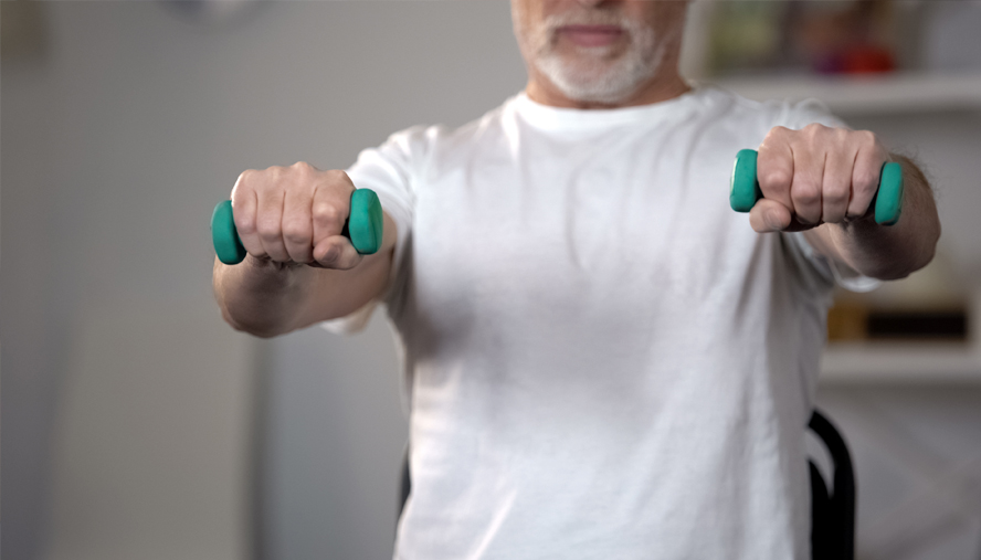 Man lifting dumbells for cardiac rehab